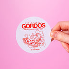 Circular custom vinyl sticker with 'World Famous Gordos New York Style Pizza' branding on a pink background.